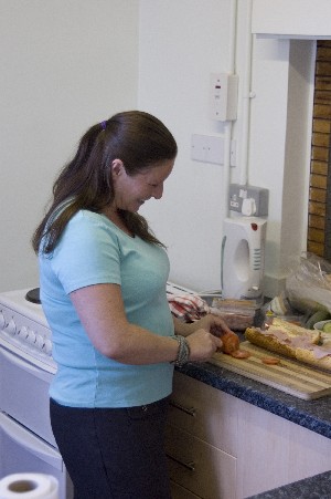  A BCU volunteer preparing sandwiches for lunch at the woman's support group 